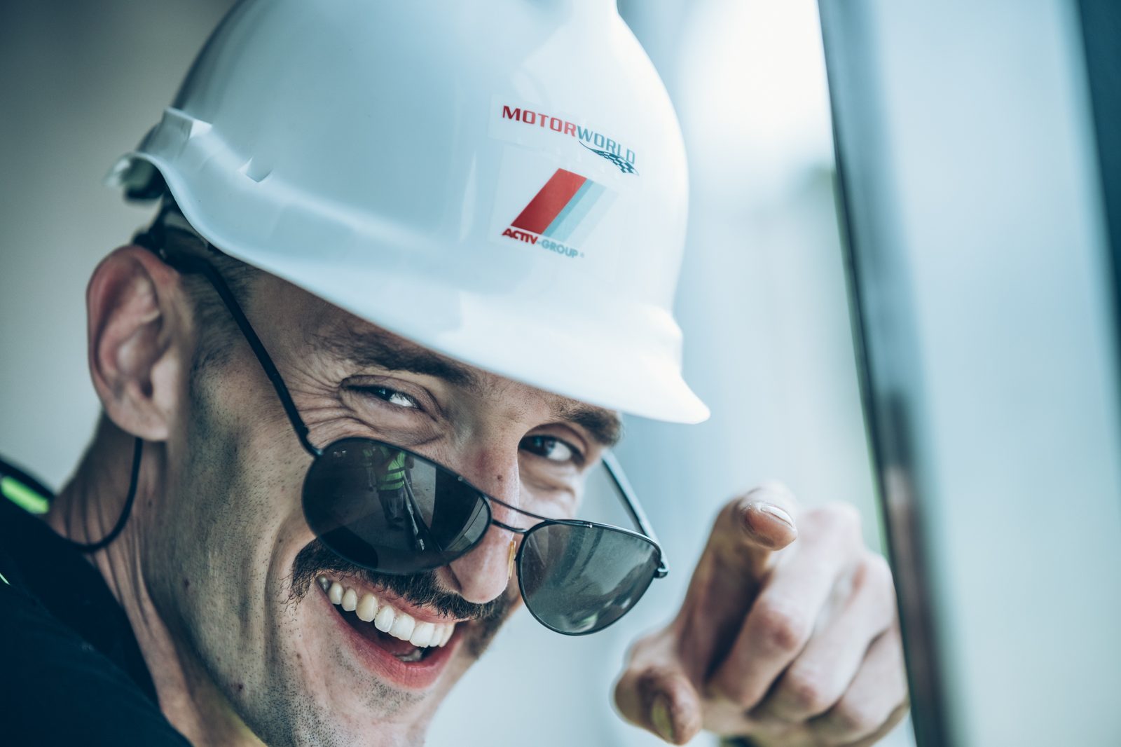 Portrait of a man in a hard hat during a production.