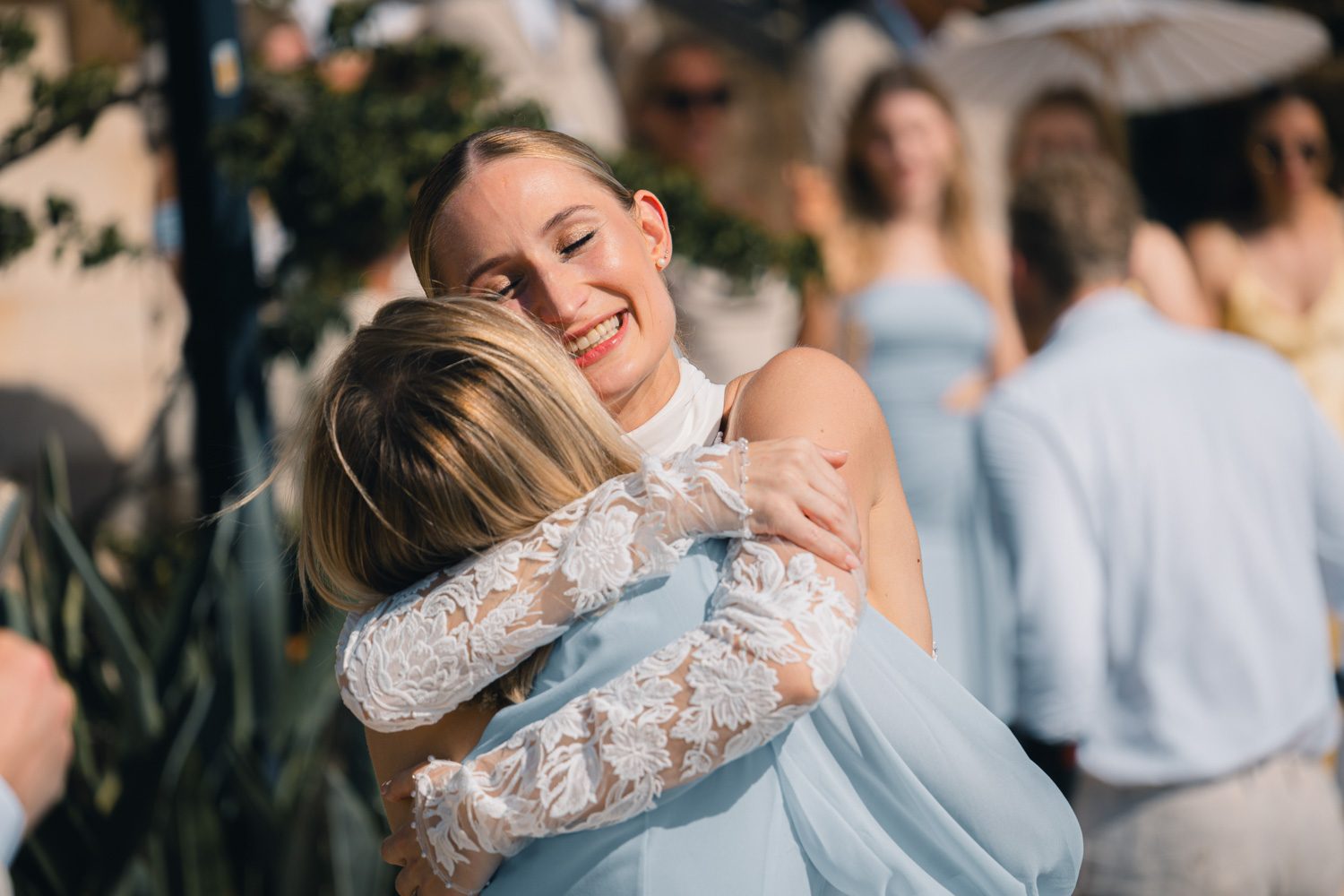 Bride embracing a child during the wedding day.