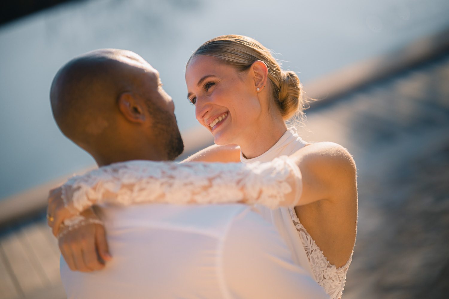 A tender close moment between the couple in the evening light.