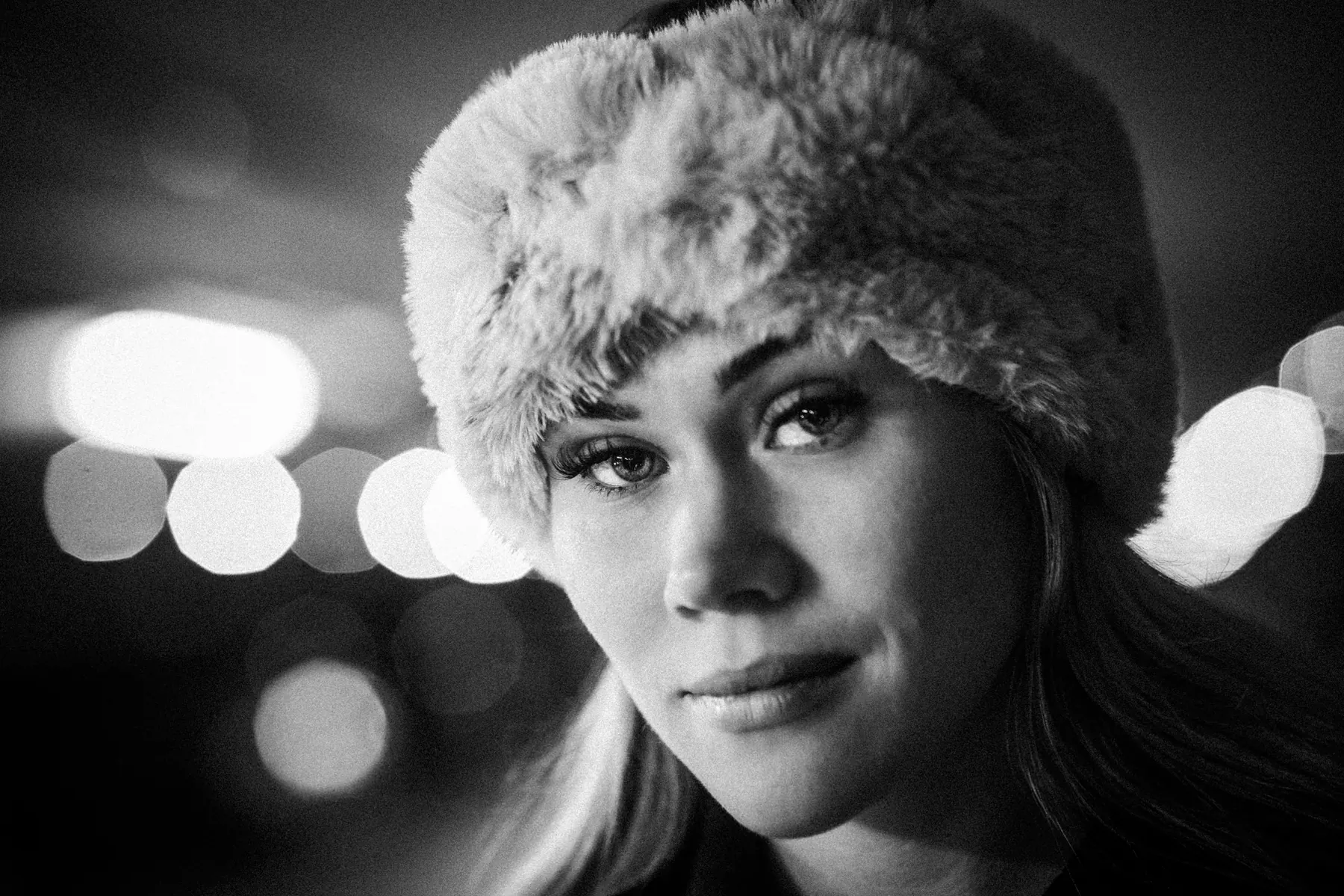 Black and white portrait of a woman at night