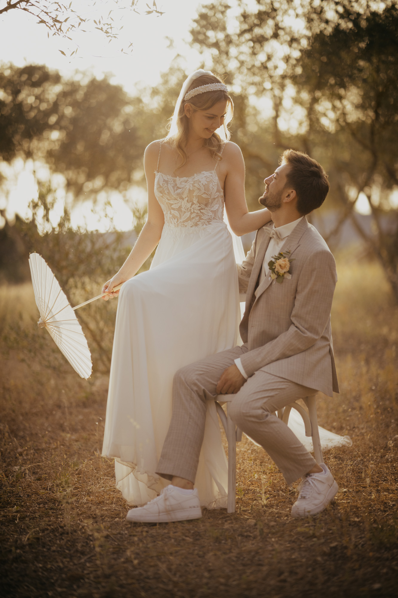 Bride and groom seated together during an outdoor wedding.