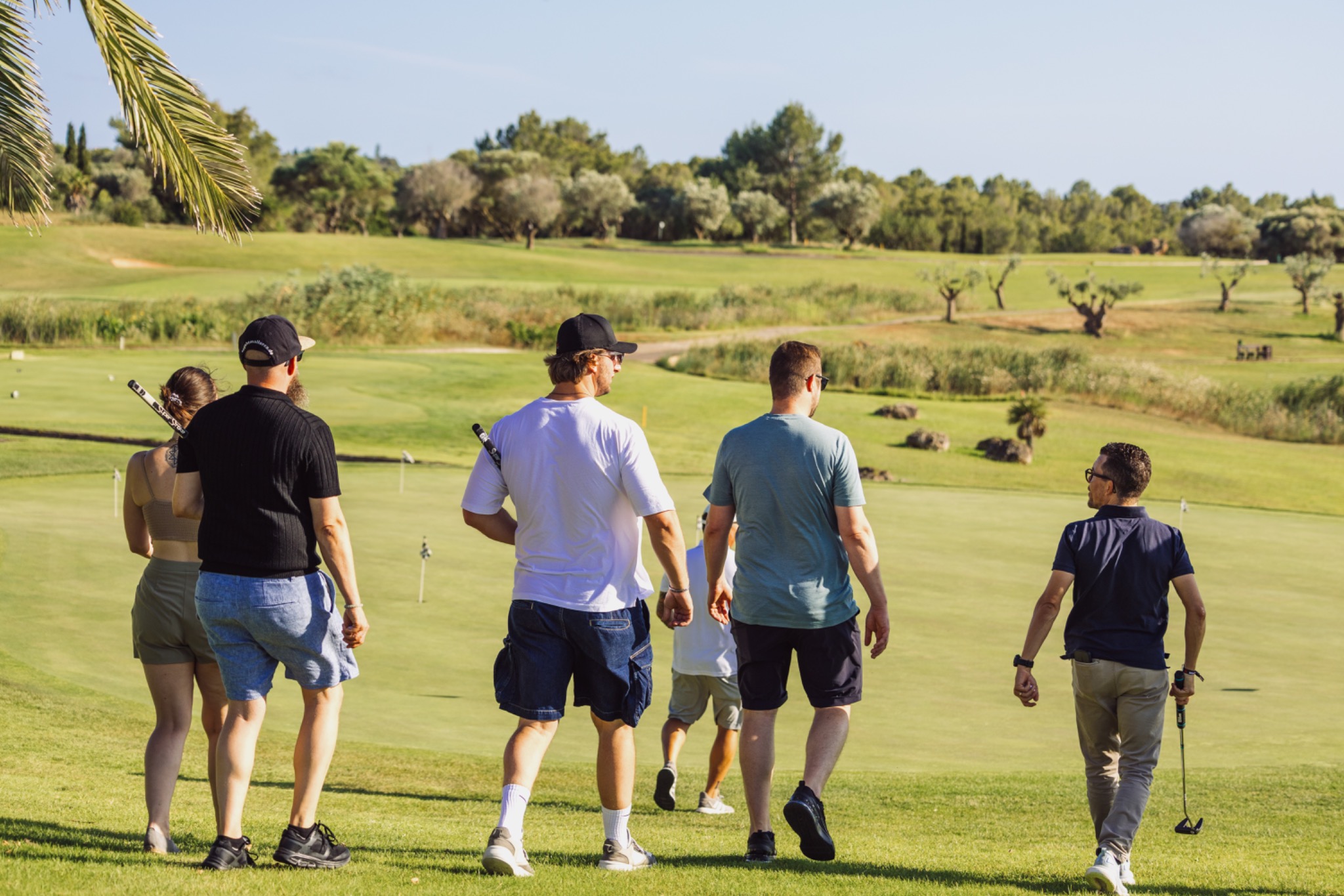 Colleagues walking away together across the course at the end of the activity