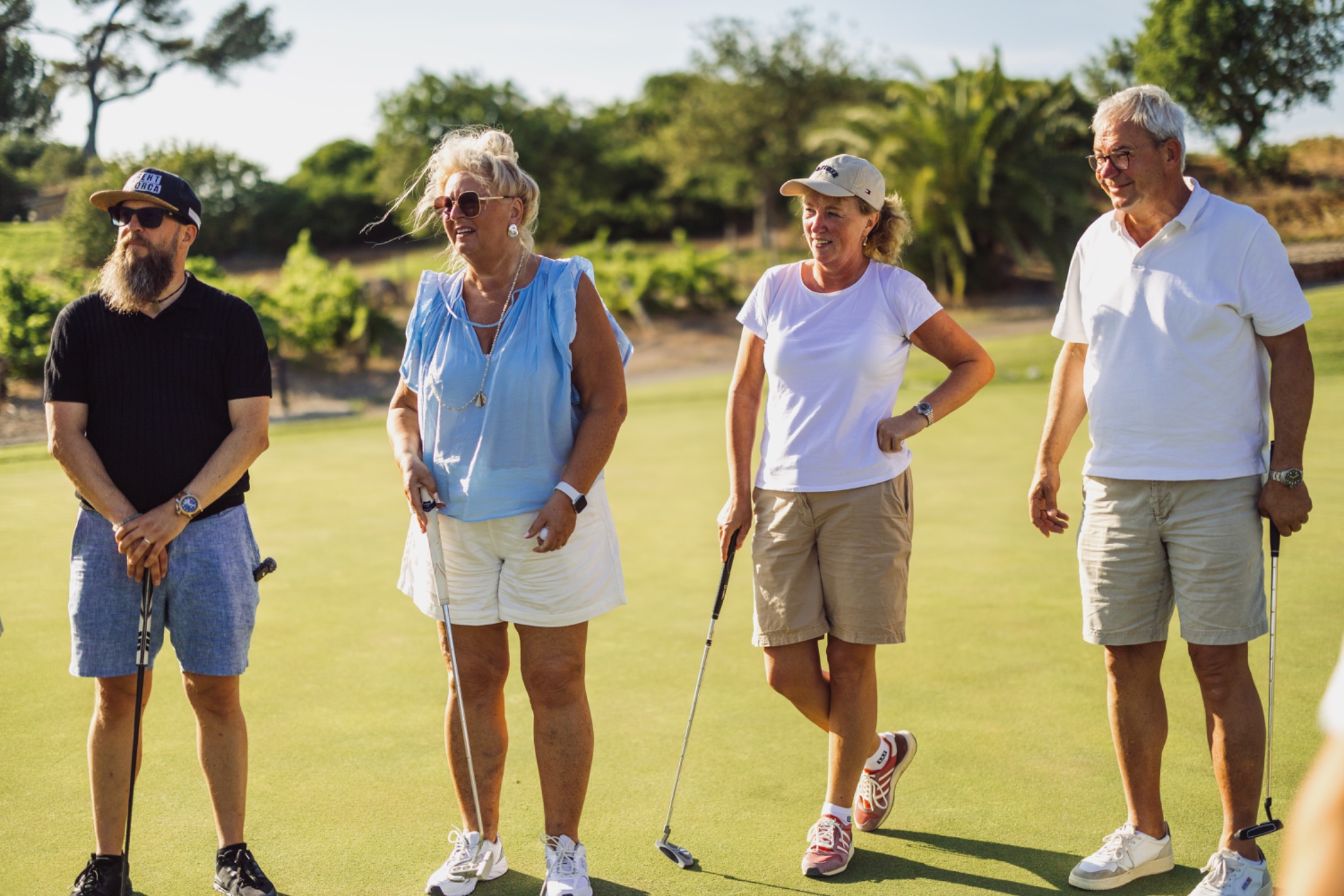 A group of colleagues walking together across the golf course