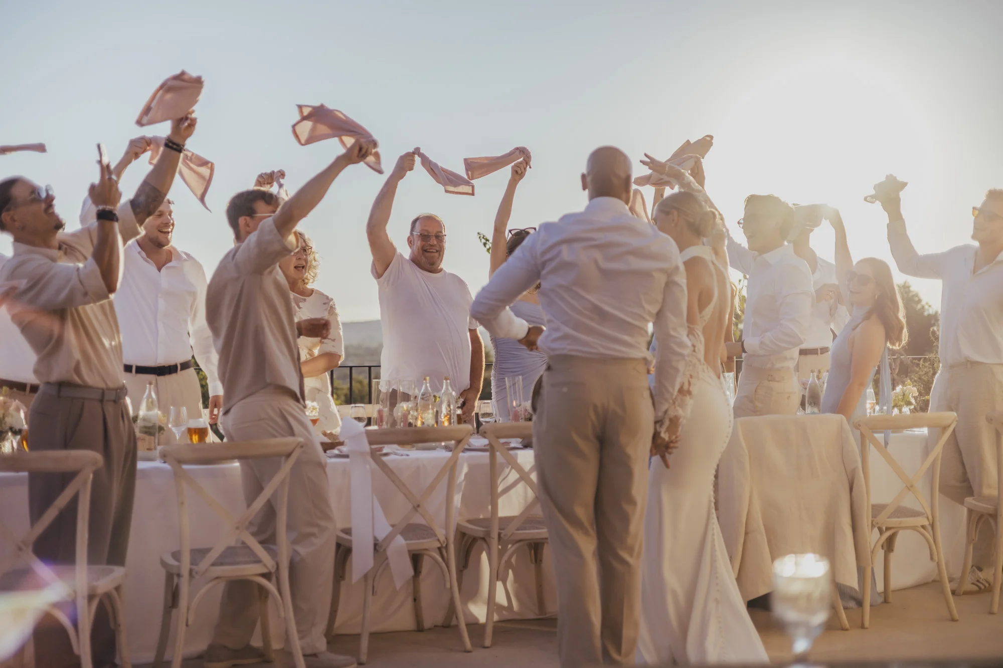 Wedding guests celebrating at an outdoor dinner on Mallorca