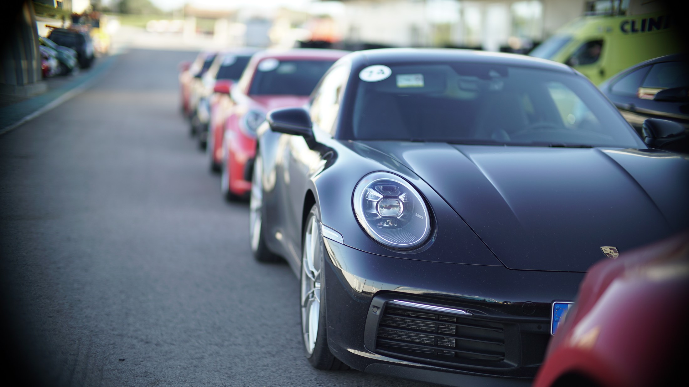 Line of sports cars arriving at an event.