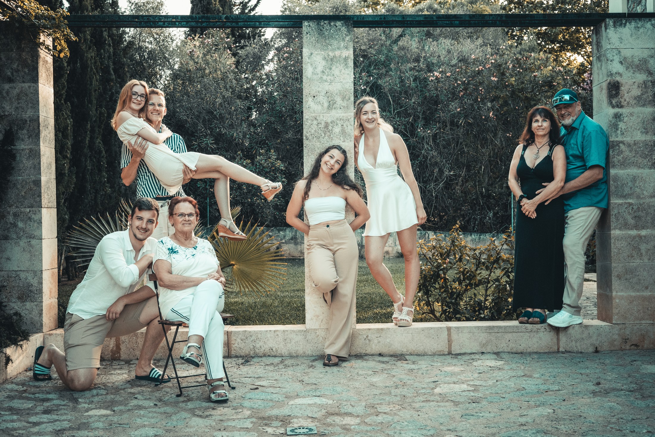 Family group portrait outdoors.