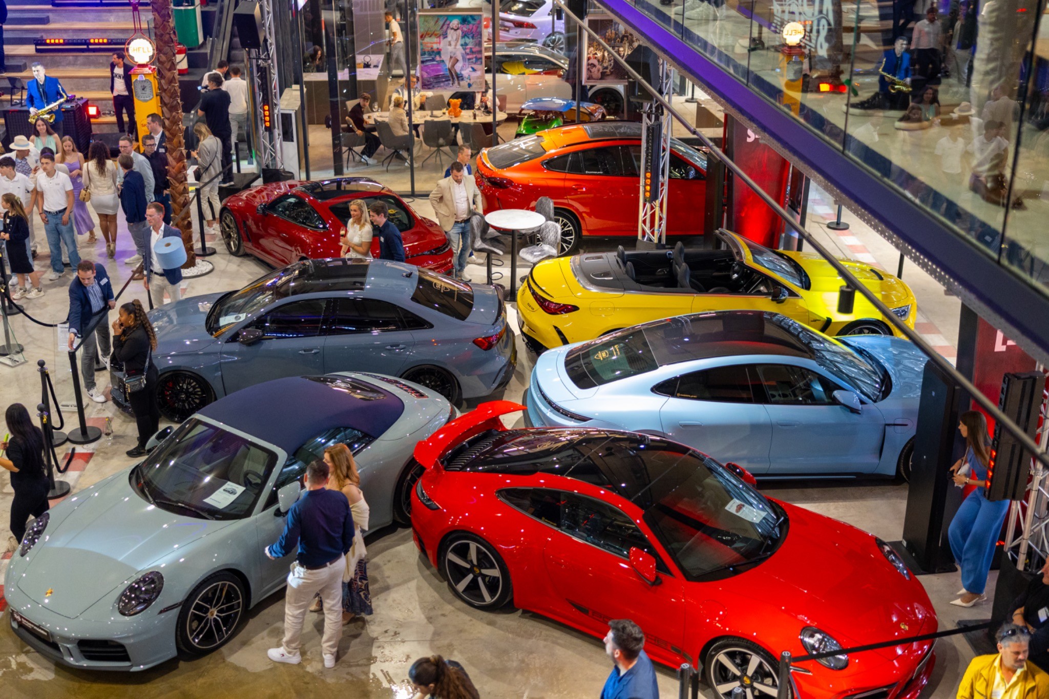 Interior view of Motorworld Mallorca with cars and guests during the opening event