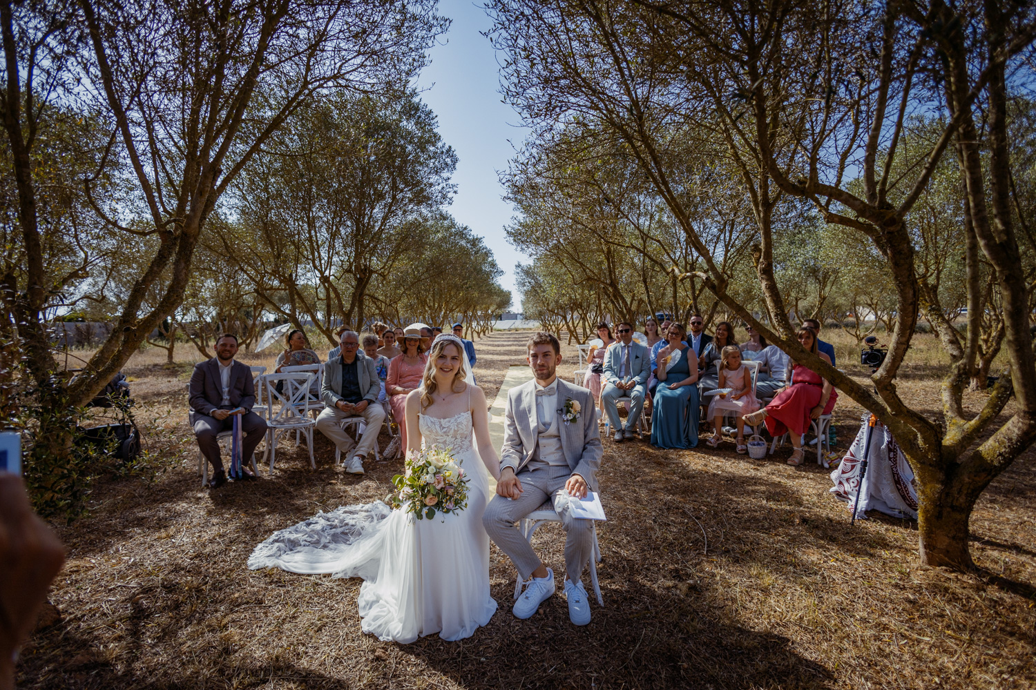 An outdoor ceremony among olive trees on Mallorca.