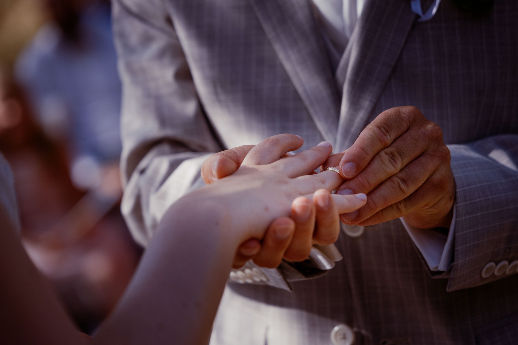 Hands and rings during the wedding ceremony.