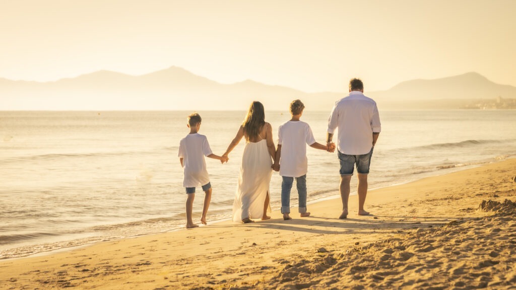 family walking on the beach
